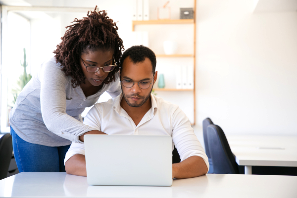 wife helping husband finish up taxes